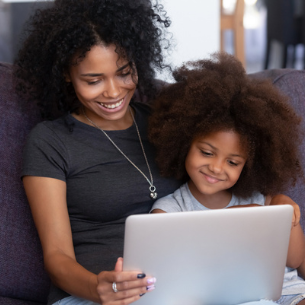  Mother and daughter looking at a laptop